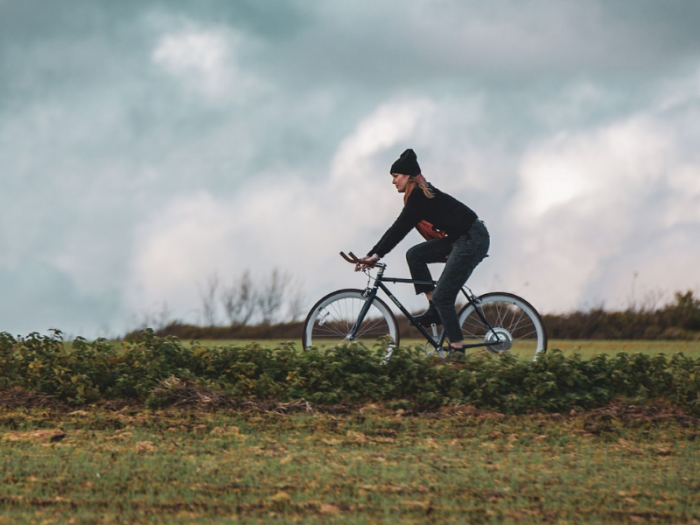Woman riding an electric bike through oxford